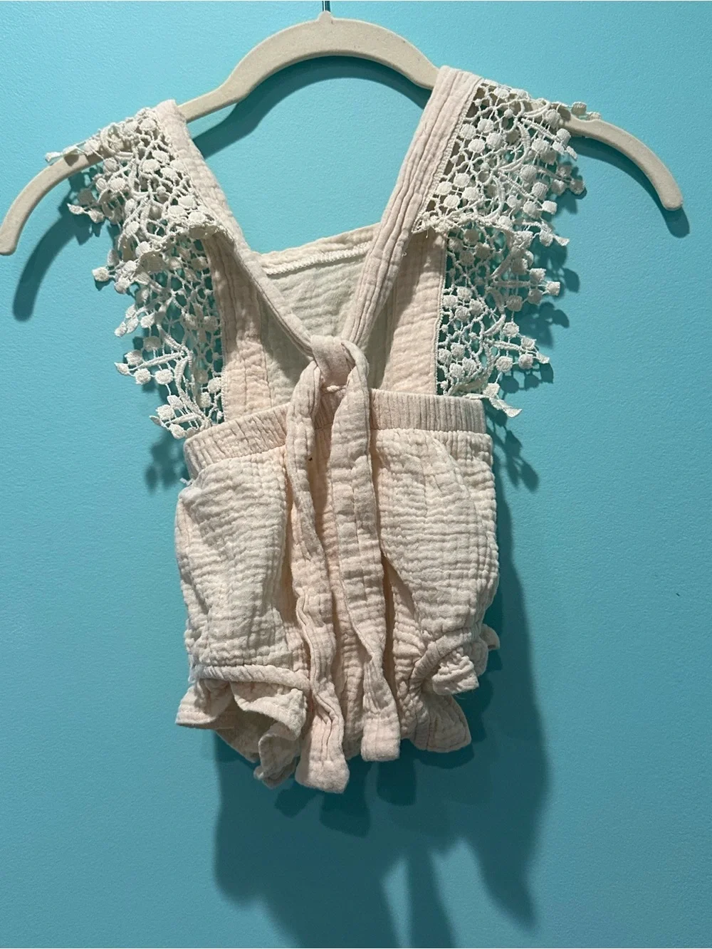 Delicate Cream Baby One-Piece Romper with Lace Straps and Satin Bow